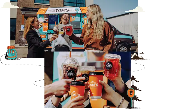 Staff members at a corporate event smile and toast with hot and iced beverages while standing in front of a Travelin' Tom's Coffee Truck
